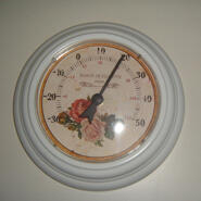 Rund termometer med rosor