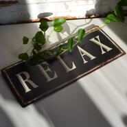 Skylt - Relax